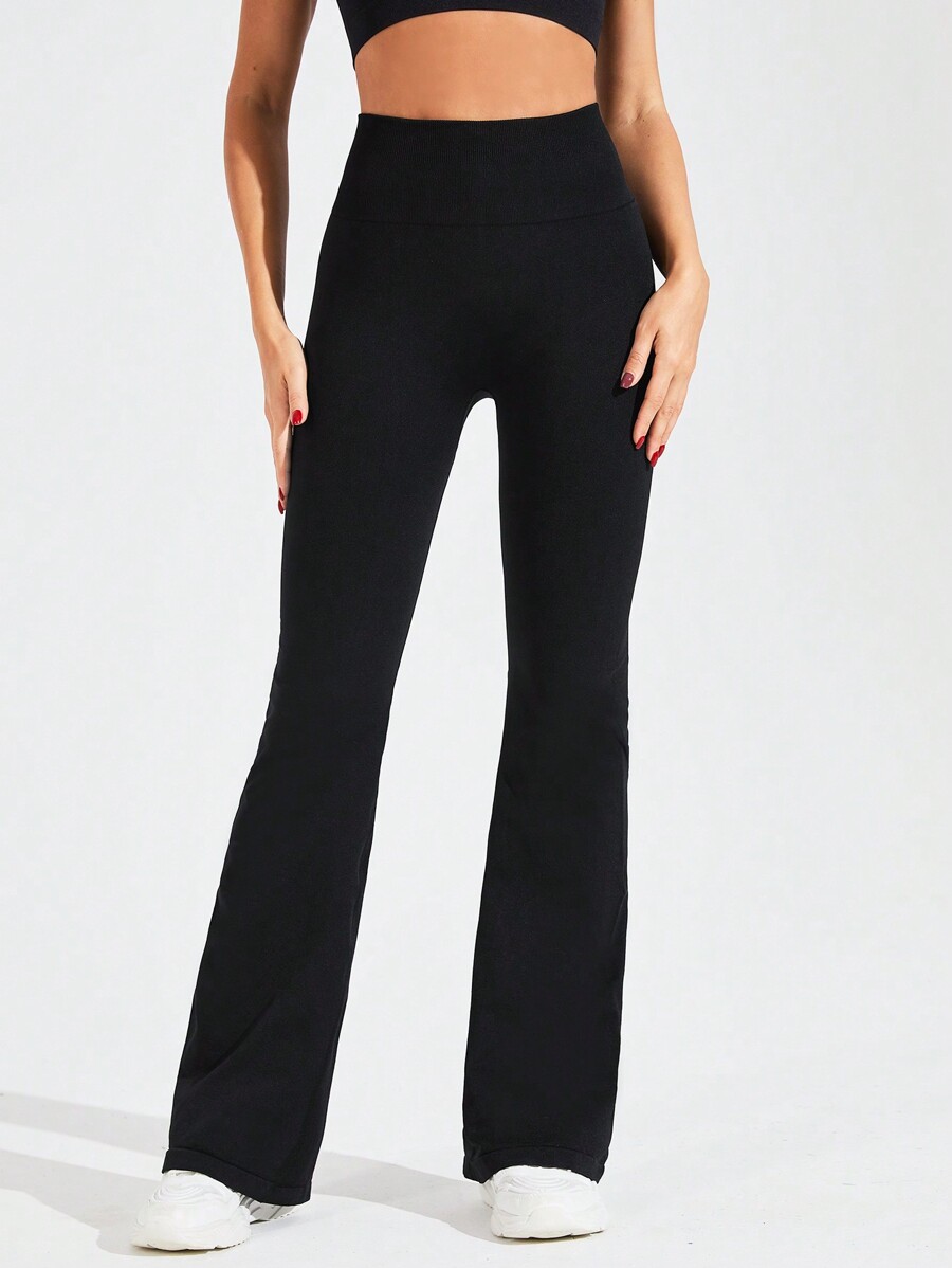 Pantalones acampanados elásticos de cintura alta en color liso